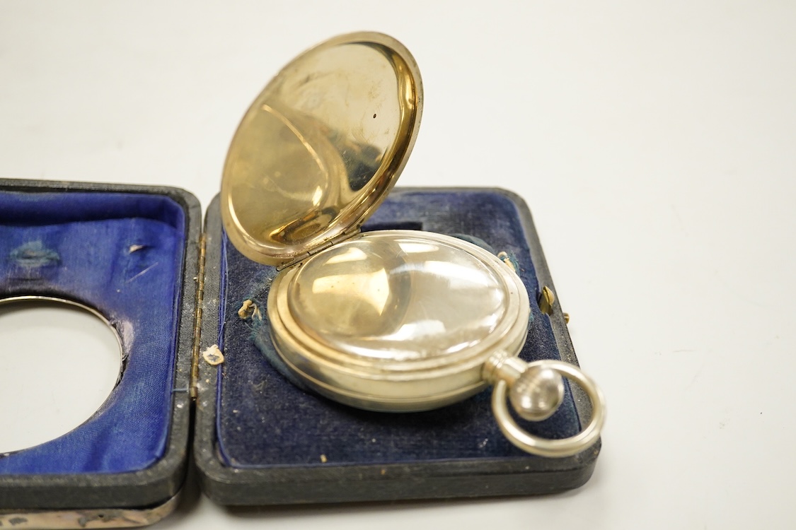 Two George V silver mounted travelling watch cases, both Birmingham, 1921, both containing chrome cased pocket watches. largest case 11.4cm.